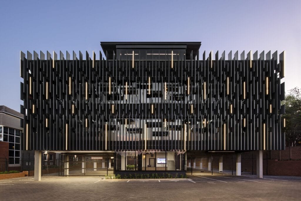 Exterior shot of a commercial office building with energy-efficient exterior LED lighting