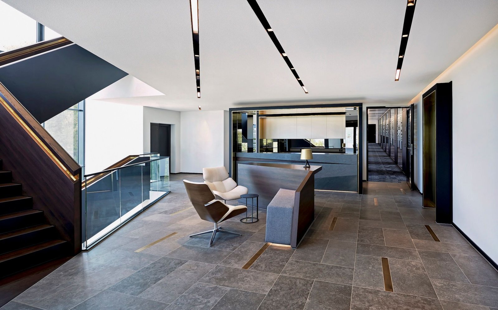 Modular recessed lighting features daylighting in a commercial office space.